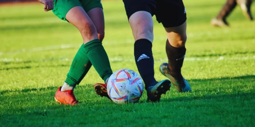 Two soccer players who may benefit from a sports injury chiropractor in Hiram, GA.