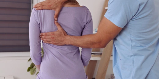 A woman receiving a chiropractic adjustment from a walk-in chiropractor in Hiram, GA.