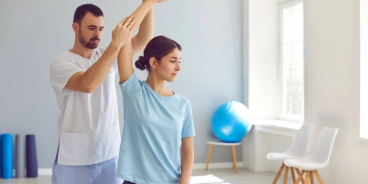 A chiropractor helping a patient with a pinched nerve.